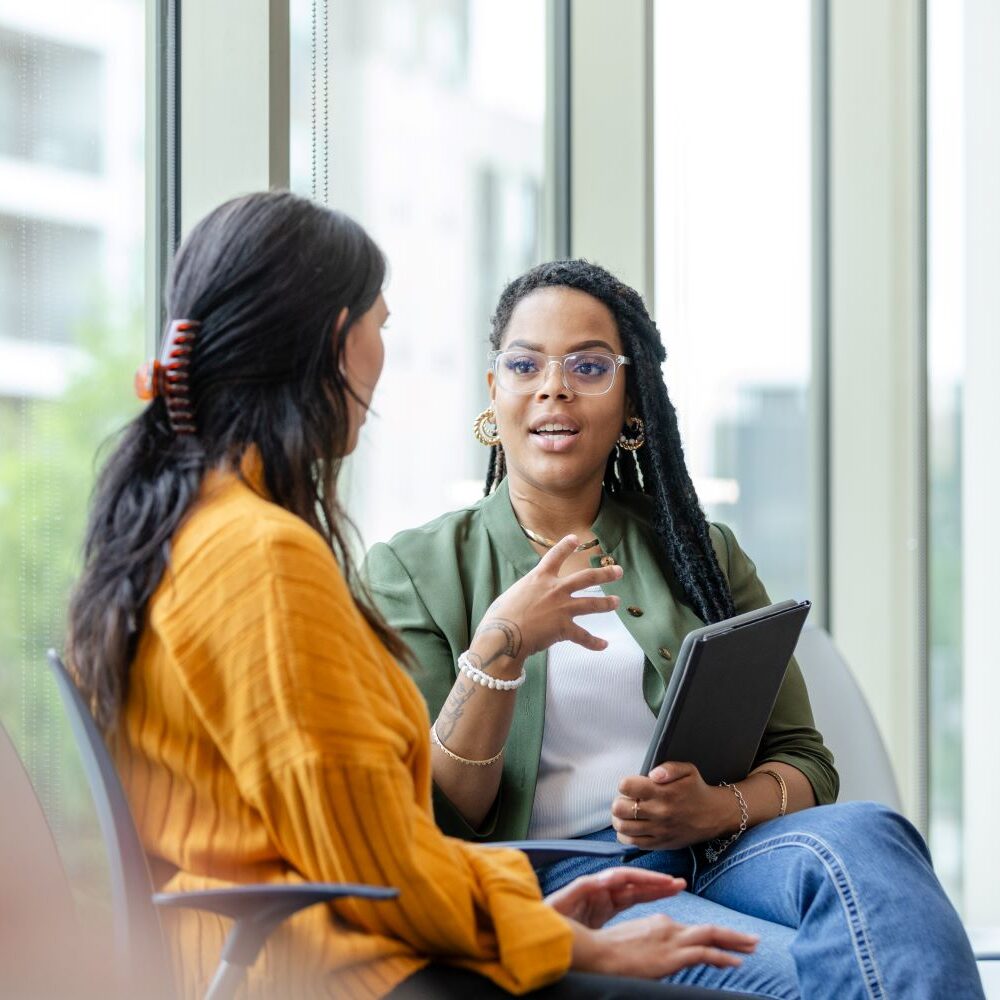 Two adult women talking