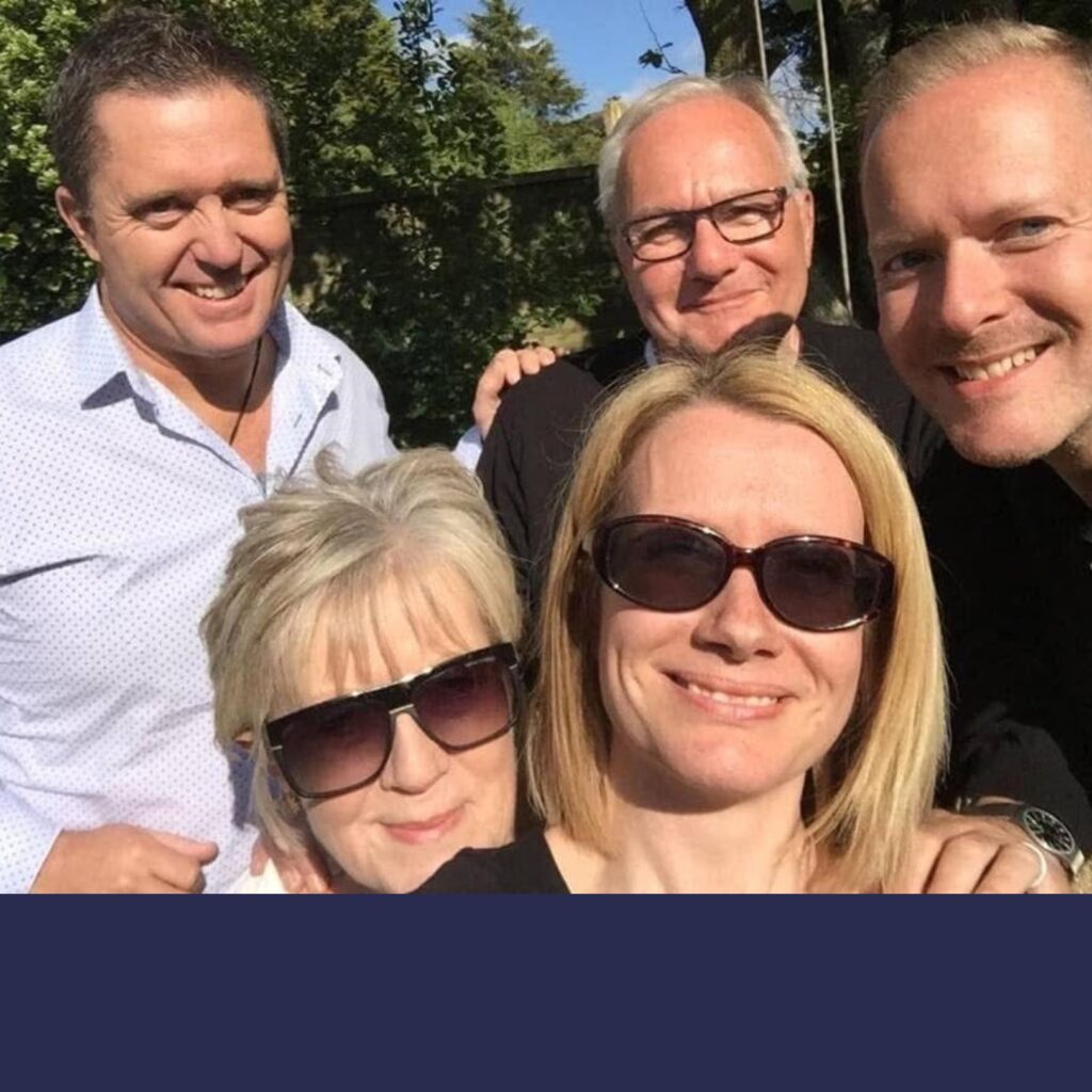 Jill and family pose for a selfie.